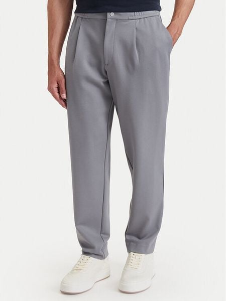 Calvin Klein Spodnie materiałowe LV04LF607G Szary Tapered Fit. Szare spodnie materiałowe CALVIN KLEIN, m, bez wzorów, z materiału. Za 529.99 zł.