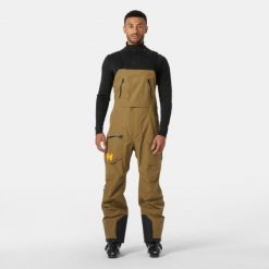 Kombinezon narciarski Helly Hansen Ridge Infinity. Brązowe spodnie narciarskie i snowboardowe Helly Hansen, m, bez wzorów, narciarskie. W wyprzedaży za 2,201.50 zł.