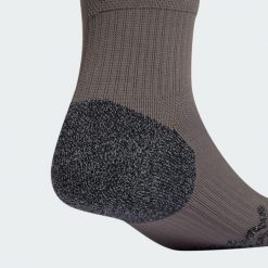 Getry Real Madrid 24/25 Third. Brązowe legginsy długie sportowe Adidas, bez wzorów, z materiału, do piłki nożnej. Za 109.00 zł.