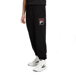 Spodnie męskie FILA Luton Track. Czarne spodnie materiałowe Fila, na co dzień, l, bez wzorów, z dresówki, casualowe. Za 159.99 zł.