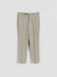 Spodnie garniturowe slim fit - oliwkowy. Zielone garnitury Reserved, l, bez wzorów, z tkaniny. Za 169.99 zł.