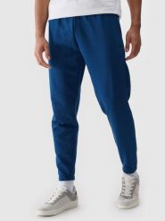4F Spodnie dresowe joggery męskie - turkusowe L. Niebieskie joggery i bojówki 4F, na co dzień, l, bez wzorów, z bawełny, sportowe. Za 149.99 zł.