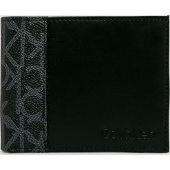 Calvin Klein - Portfel. Czarne portfele CALVIN KLEIN, bez wzorów, z materiału. W wyprzedaży za 219.90 zł.
