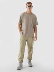 4F Spodnie dresowe oversize męskie - oliwkowe/khaki XL. Brązowe spodnie materiałowe 4F, na co dzień, m, bez wzorów, z bawełny, sportowe. W wyprzedaży za 79.99 zł.