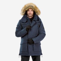 Parka turystyczna męska zimowa Quechua NH900 -20°C wodoodporna. Niebieskie kurtki przeciwdeszczowe QUECHUA, na zimę, m, bez wzorów, z syntetyku, bez kaptura. Za 499.99 zł.