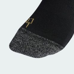Getry z trzeciego zestawu Juventus 26/27. Czarne legginsy długie sportowe Adidas, l, bez wzorów, z bawełny, do piłki nożnej. Za 99.95 zł.