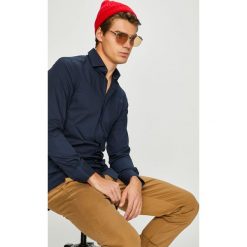 Tommy Hilfiger Tailored - Koszula. Białe koszule Tommy Hilfiger Tailored, m, bez wzorów, z bawełny, bez kołnierzyka, bez ramiączek. W wyprzedaży za 339.90 zł.