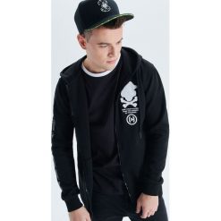 Rozpinana bluza z kapturem Progress - Czarny. Bluzy z kapturem marki DOMYOS. Za 139.99 zł.