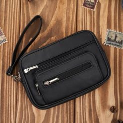 Saszetka męska skórzana do ręki elegancka klasyczna czarna Abruzzo ABR-50. Czarne torby na ramię bez wzorów, ze skóry, do ręki, bez dodatków. Za 99.00 zł.