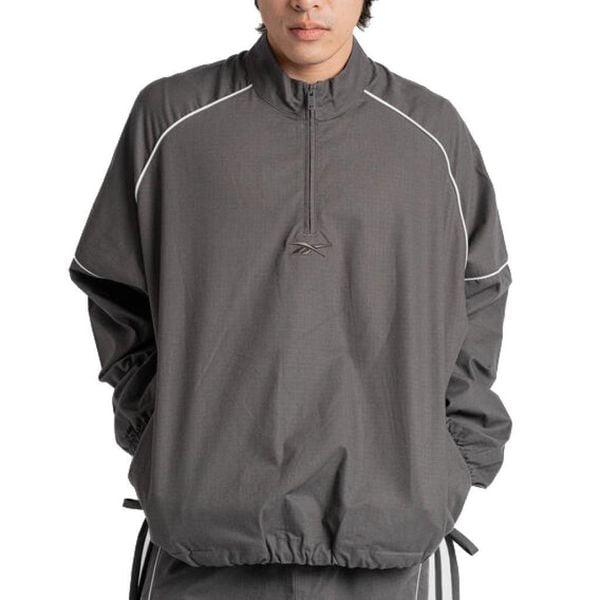 Kurtka REEBOK TRACK JACKET Czarny. Czarne kurtki Reebok, bez wzorów, z tkaniny, bez kaptura. Za 369.99 zł.