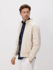 Wodoodporna kurtka - złamana biel. Kurtki Reserved, l, bez wzorów, z bawełny, bez kaptura. Za 239.99 zł.