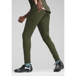 Męskie spodnie treningowe Manchester City PUMA Myrtle Bold Blue Green. Niebieskie spodnie treningowe długie Puma, m, bez wzorów, z dresówki. W wyprzedaży za 216.50 zł.