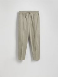 Spodnie jogger z lnem - beżowy. Brązowe joggery i bojówki Reserved, l, bez wzorów, z bawełny. Za 219.99 zł.