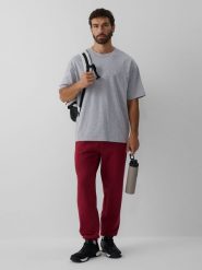 4F Spodnie dresowe joggery męskie - burgundowe XXL. Czerwone joggery i bojówki 4F, l, bez wzorów, z dresówki, klasyczne. Za 149.99 zł.