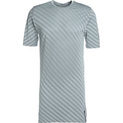 ASICS SEAMLESS Tshirt z nadrukiem stone grey. T-shirty ASICS. Za 229.00 zł.