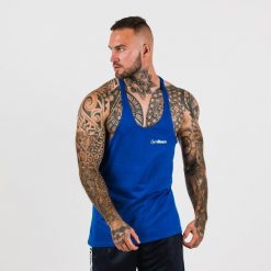 Podkoszulek męski fitness oddychający granatowy Stringer. Niebieskie podkoszulki GYMBEAM, m, bez wzorów, z bawełny, bez ramiączek. Za 42.90 zł.