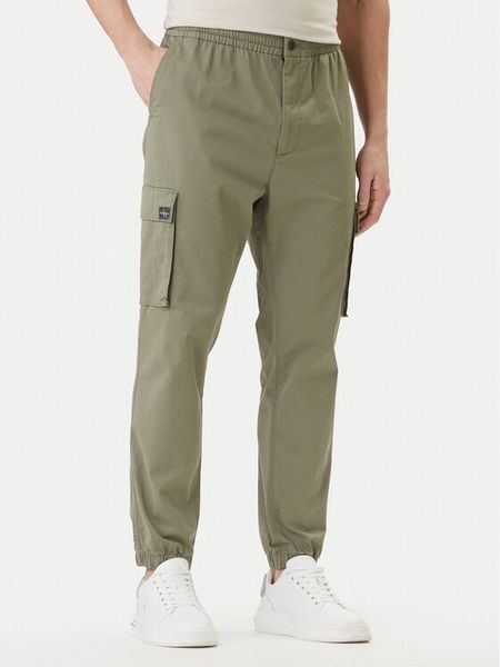 Calvin Klein Jeans Joggery Comfort LV04RD608G Beżowy Skinny Fit. Brązowe joggery i bojówki Calvin Klein Jeans, m, bez wzorów, z bawełny. Za 409.99 zł.