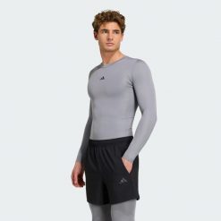 Koszulka TECHFIT Compression Training Long Sleeve. Niebieskie odzież kompresyjna Adidas, l, bez wzorów, z dzianiny, techfit (adidas). Za 152.15 zł.