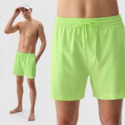 SPODENKI MĘSKIE 4F SPORTOWE PLAŻOWE KĄPIELOWE PRZED KOLANO KOLOR ZIELONY. Zielone krótkie spodenki sportowe 4F, l, bez wzorów, z materiału. Za 79.99 zł.