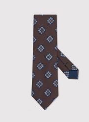 PAKO LORENTE – Brązowy krawat męski we wzór geometryczny. Brązowe krawaty i muchy Pako Lorente, bez wzorów, z poliesteru. Za 99.99 zł.