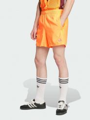 Adidas Szorty sportowe "Adicolor 3-Stripes Swim" w kolorze pomarańczowym rozmiar: L. Pomarańczowe krótkie spodenki sportowe Adidas, l, bez wzorów, z materiału. Za 79.77 zł.