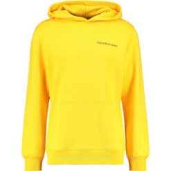 Calvin Klein Jeans HOROS 2 REGULAR POPOVER Bluza z kapturem spectra yellow. Bluzy marki Calvin Klein Jeans. Za 499.00 zł.
