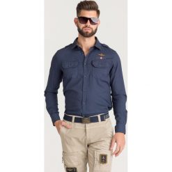 KOSZULA Aeronautica Militare. Niebieskie koszule Aeronautica Militare, l, bez wzorów, z bawełny, bez kołnierzyka, bez ramiączek. Za 569.00 zł.