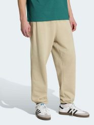 Adidas Spodnie dresowe w kolorze beżowym rozmiar: L. Brązowe spodnie treningowe długie Adidas, l, bez wzorów, z dresówki. Za 154.95 zł.