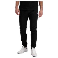 Wąskie spodnie do biegania Le Coq Sportif Pantalon de jogging ample Le Coq Sport. Czarne buty do biegania le coq sportif, bez wzorów. Za 318.95 zł.