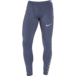 Nike Performance POWER FLASH TECH Legginsy thunder blue/reflect black/silver. Spodnie treningowe długie marki Nike Performance, z elastanu. W wyprzedaży za 209.25 zł.