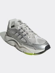 Adidas Skórzane sneakersy w kolorze srebrno-białym rozmiar: 38,5. Białe buty sportowe casual Adidas, bez wzorów, bez zapięcia. Za 342.60 zł.