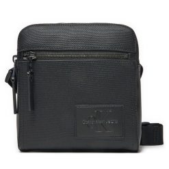 Saszetka Calvin Klein Jeans. Czarne saszetki i nerki Calvin Klein Jeans, bez wzorów, z jeansu. Za 229.99 zł.