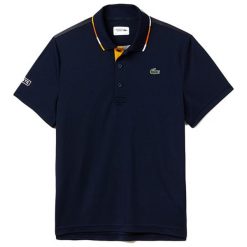 Koszulka polo w kolorze granatowym. Koszulki polo sportowe marki LACOSTE. W wyprzedaży za 277.95 zł.