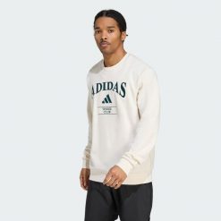 Bluza adidas Heritage Graphic Crew. Niebieskie bluzy Adidas, xl, bez wzorów, bez kaptura. Za 329.00 zł.