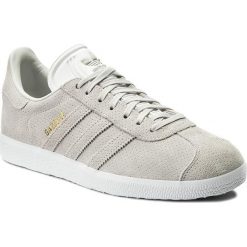 Buty adidas - Gazelle BZ0027 Greone/Greone/Goldmt. Brązowe buty sportowe casual marki Adidas, w paski, ze skóry ekologicznej. W wyprzedaży za 259.00 zł.