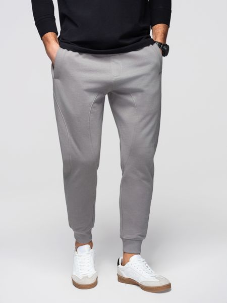 Męskie spodnie dresowe ze ściągaczem przy nogawce BASIC jogger - szare V8 - Rozmiar: M. Szare joggery i bojówki Ombre Clothing, m, z aplikacjami, z bawełny. W wyprzedaży za 118.99 zł.