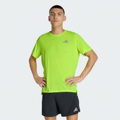 Koszulka adi365Breeze Running. Żółte buty do biegania Adidas, bez wzorów, bez zapięcia, do biegania, climacool (adidas). Za 179.00 zł.