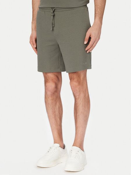 HUGO Szorty sportowe Austin 50532023 Zielony ciemny Regular Fit. Zielone krótkie spodenki sportowe Hugo, m, bez wzorów, z bawełny. Za 206.99 zł.