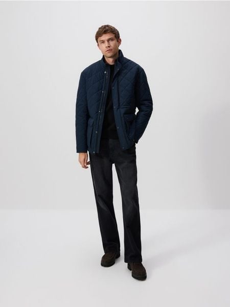 Pikowana kurtka ze stójką - granatowy. Niebieskie kurtki Reserved, l, bez wzorów, z tkaniny, bez kaptura. Za 259.99 zł.