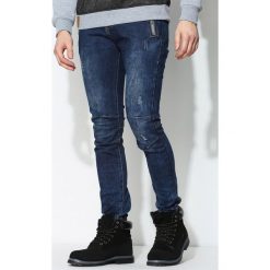Granatowe Jeansy Deserved. Jeansy marki Under Armour. Za 74.99 zł.