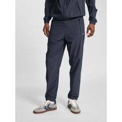 Spodnie dresowe tkane Hummel Pulse. Brązowe szorty Hummel, bez wzorów, z dresówki, sportowe. Za 239.00 zł.