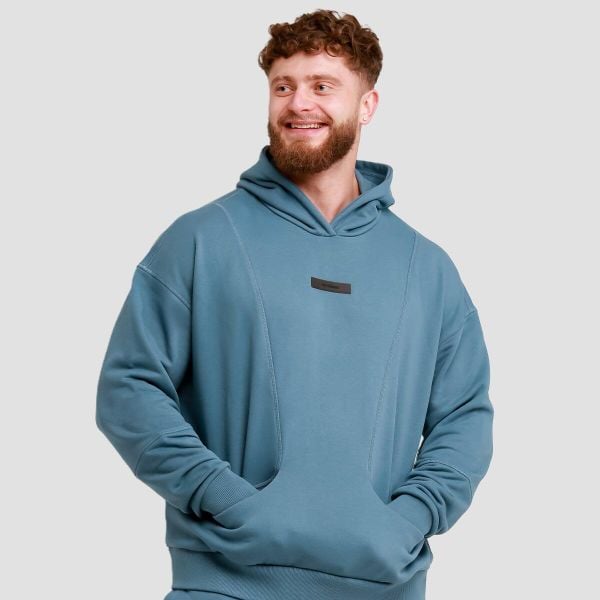 Bluza męska fitness z kapturem Unity. Niebieskie bluzy z kapturem GYMBEAM, l, bez wzorów, z bawełny, z kapturem. Za 122.90 zł.