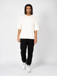 Fila T-Shirt "Castellar" | FAM0303 | Mężczyzna | Beżowy. Brązowe t-shirty Fila, m, bez wzorów, z elastanu, bez kołnierzyka, bez ramiączek. W wyprzedaży za 139.00 zł.