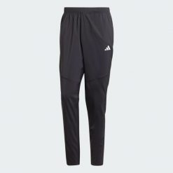 Spodnie Own The Run. Czarne buty do biegania Adidas, bez wzorów, z materiału, bez zapięcia, do biegania. Za 259.00 zł.