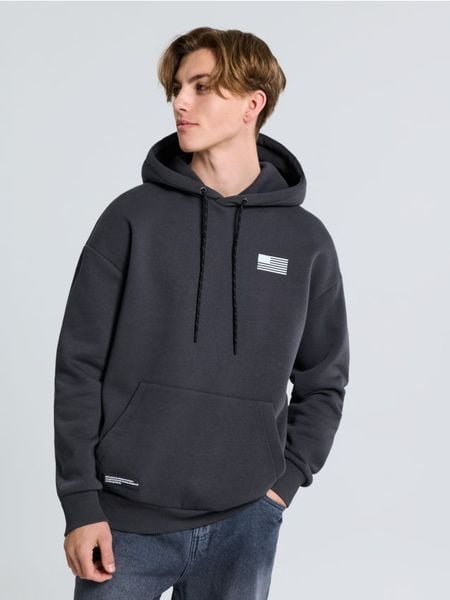 Bluza z nadrukiem na plecach NASA - szary. Szare bluzy bez kaptura Sinsay, l, bez wzorów, bez kaptura. W wyprzedaży za 25.99 zł.