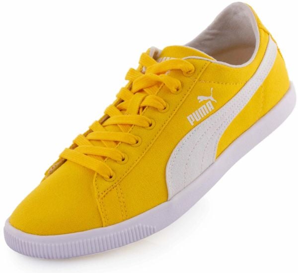 Puma Glyde Low tenisówki tekstylne żółte. Żółte trampki Puma, bez wzorów, bez zapięcia. Za 254.99 zł.