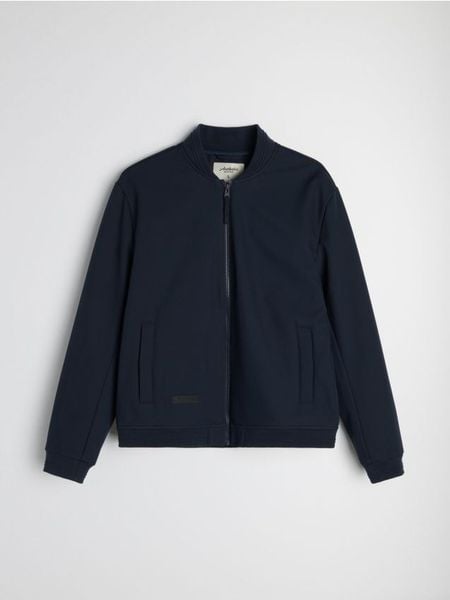 Kurtka softshell bomber - granatowy. Niebieskie kurtki Sinsay, l, bez wzorów, z softshellu, bez kaptura. Za 99.99 zł.