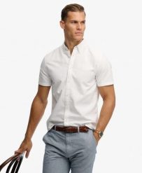 Superdry Koszula Preppy Oxford krótki rękaw z bawełny organicznej – OPTIC. Białe koszule Superdry, m, bez wzorów, z bawełny, bez kołnierzyka, bez ramiączek. Za 254.60 zł.