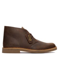Trzewiki Clarks. Brązowe botki sznurowane Clarks, bez wzorów, bez obcasa, bez zapięcia. Za 629.99 zł.