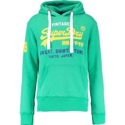 Superdry STORE TRI HOOD Bluza z kapturem kelly green marl. Bluzy z kapturem marki Superdry, m, z bawełny, z kapturem. W wyprzedaży za 305.10 zł.